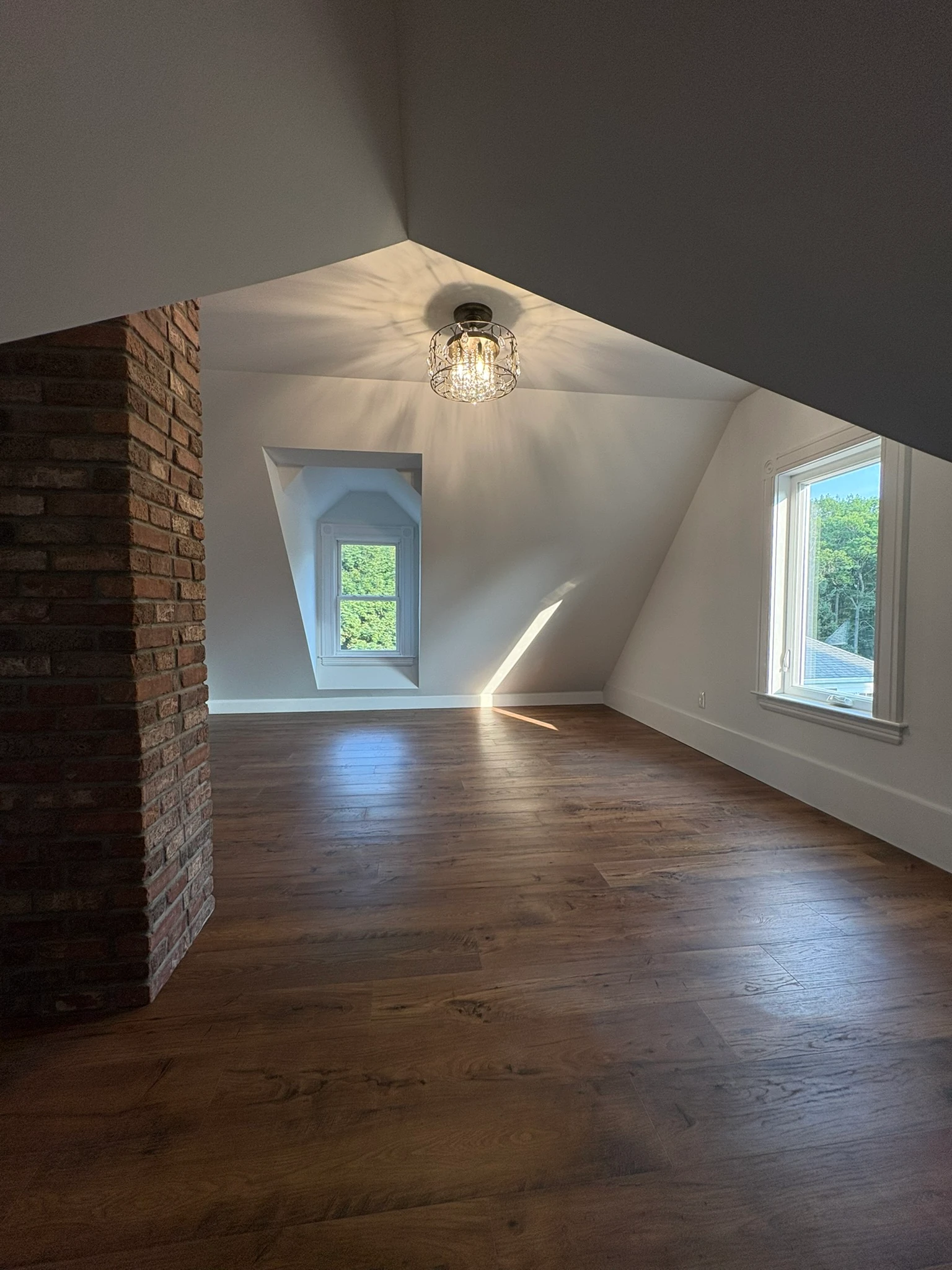 Finished attic beside the preserved brick chimney