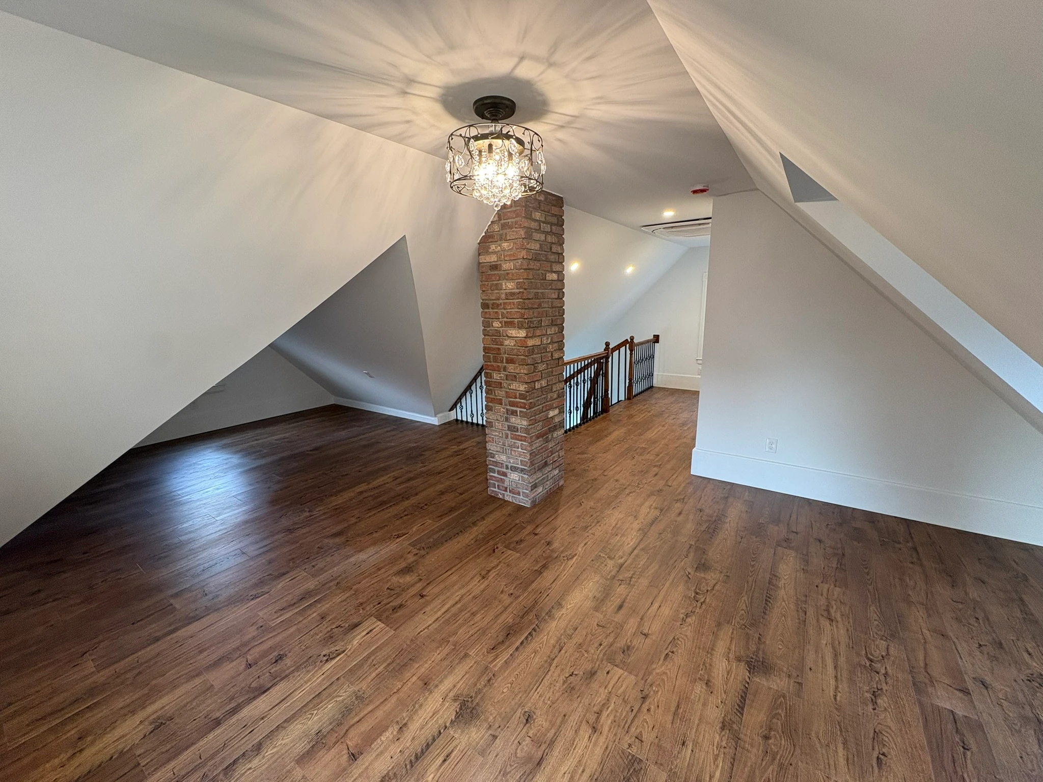 Restored attic beside the brick chimney