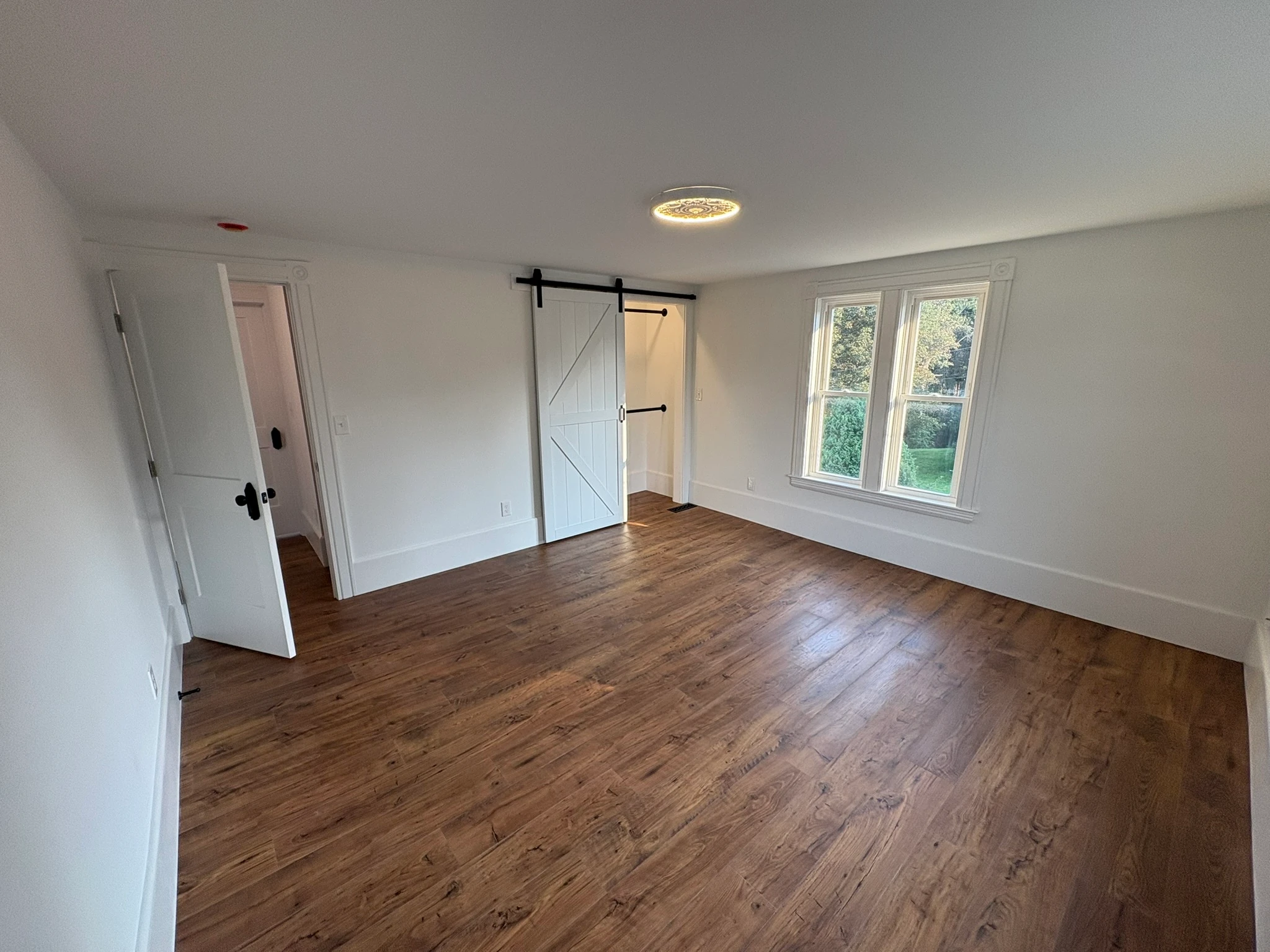 Second restored bedroom with double windows