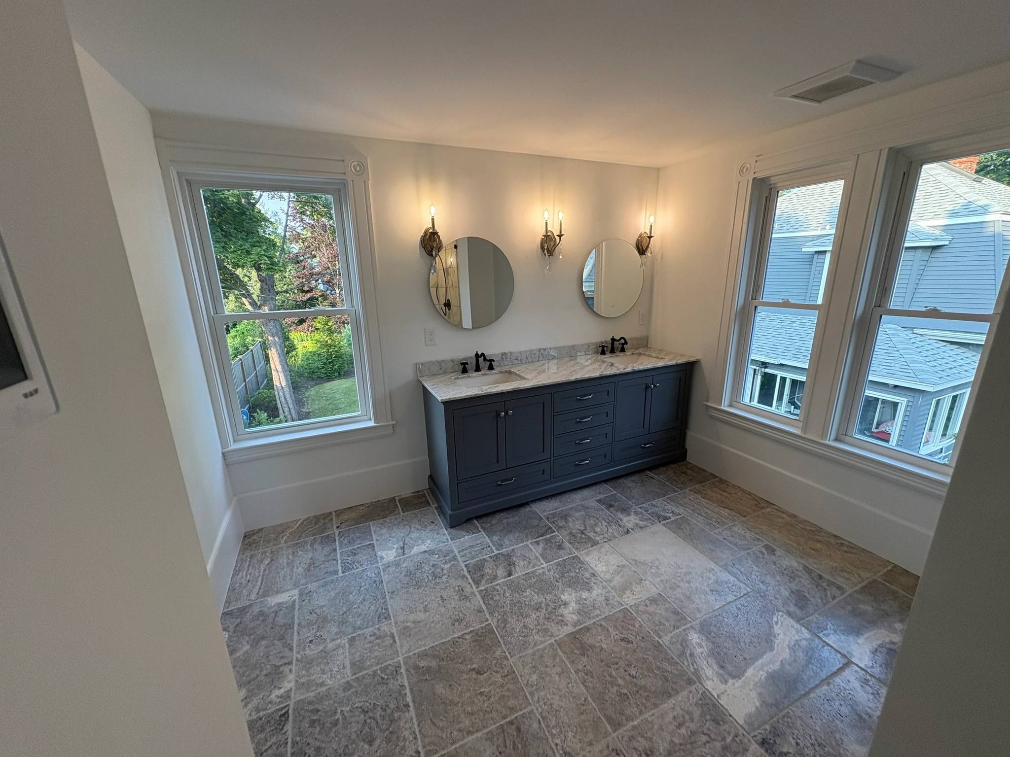 The primary bath — vanity with dual mirrors