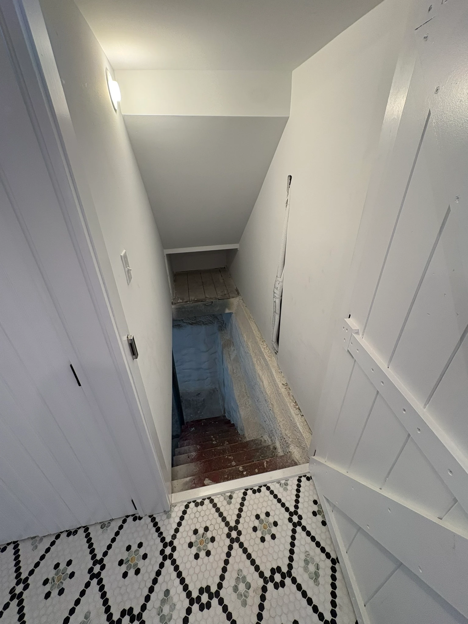 Glimpse of the back stair off the finished hall