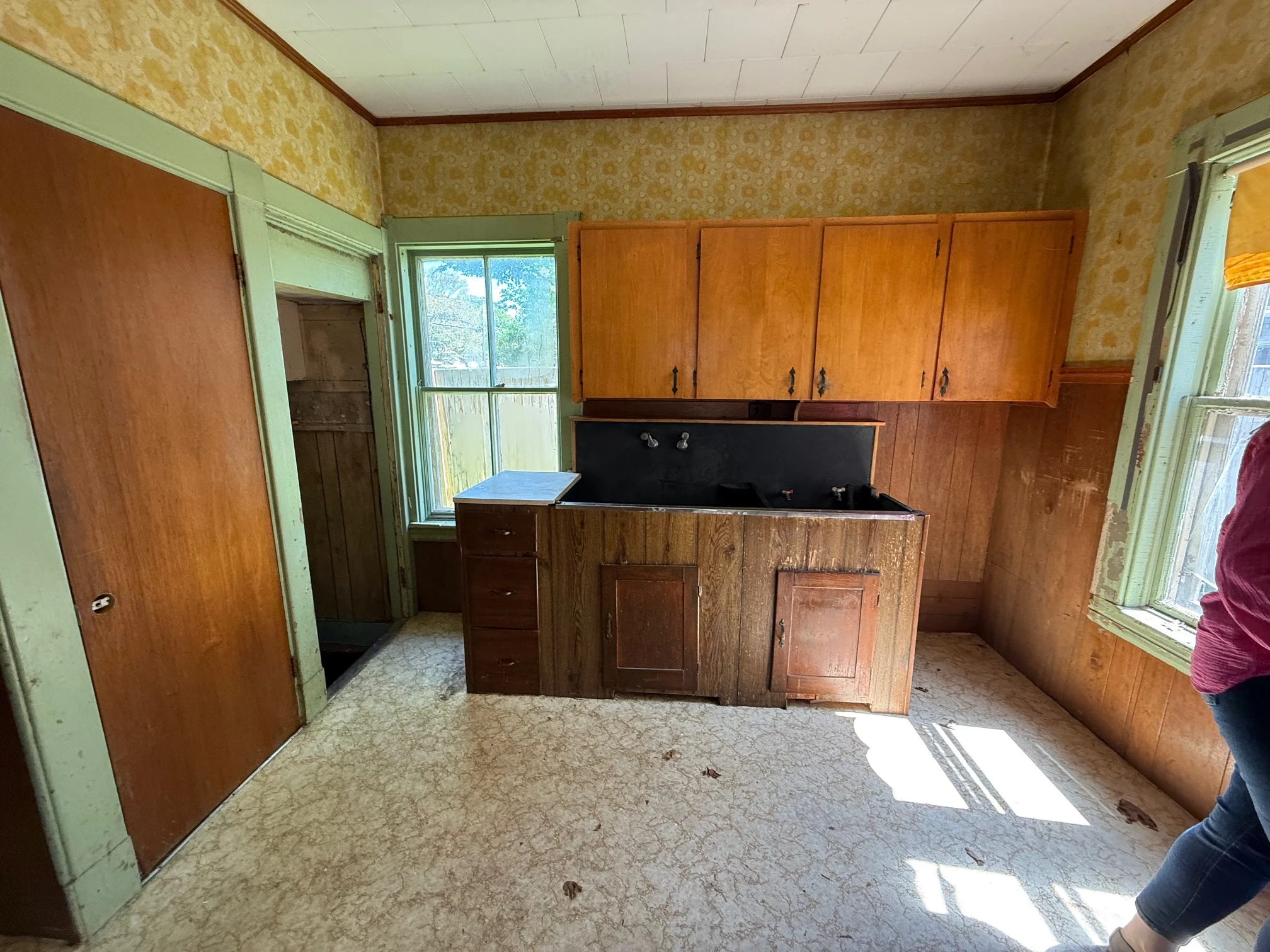 The original kitchen — old cabinetry and sink