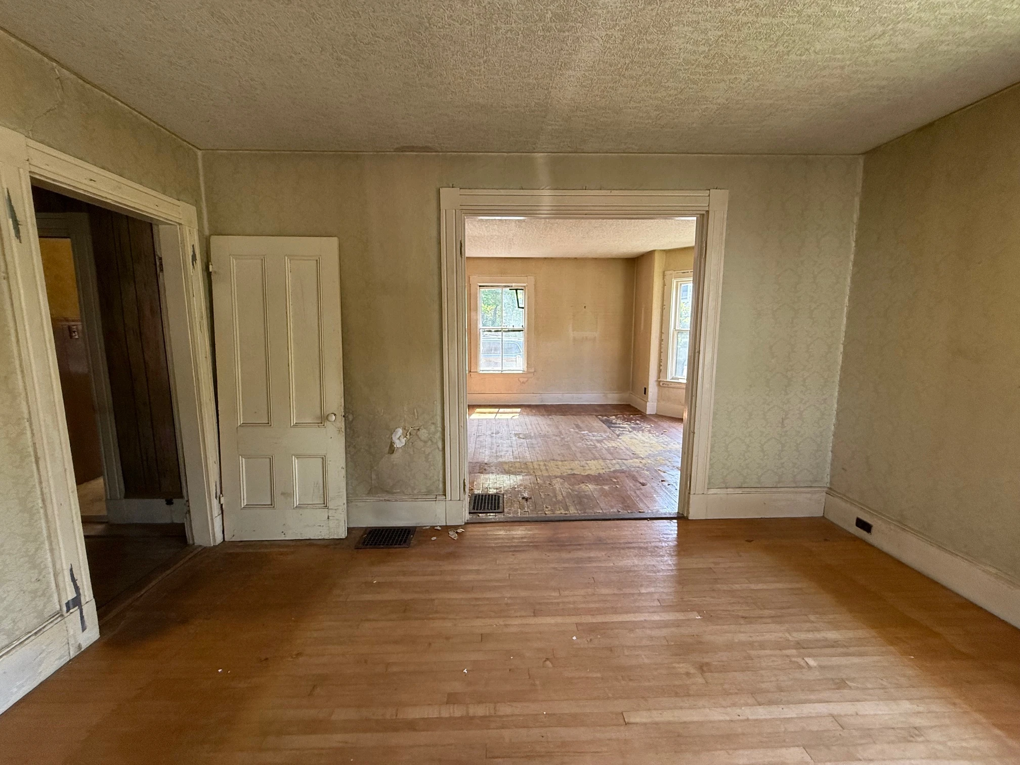 First-floor room seen through a broad opening