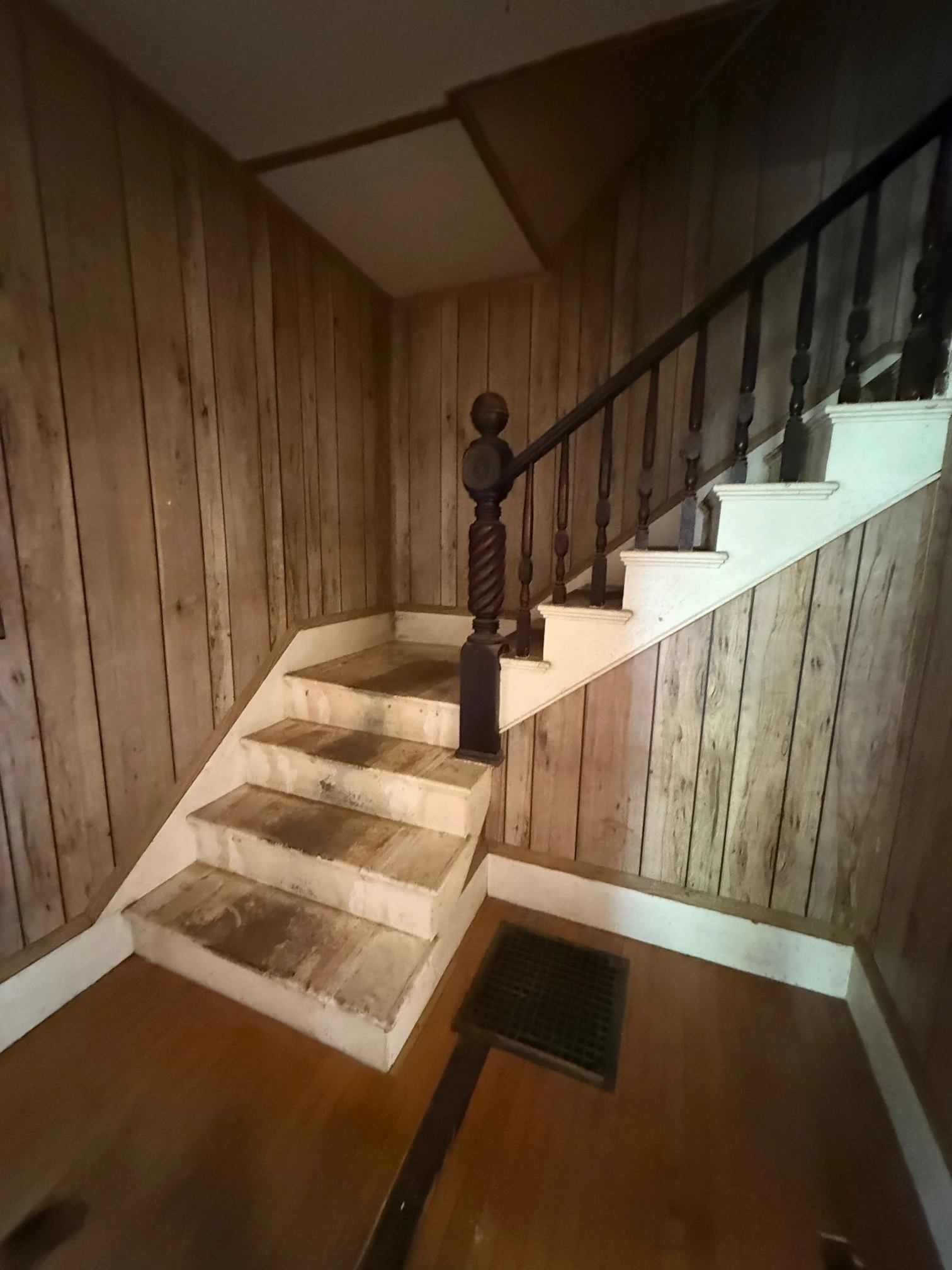The original staircase with turned newel, from below