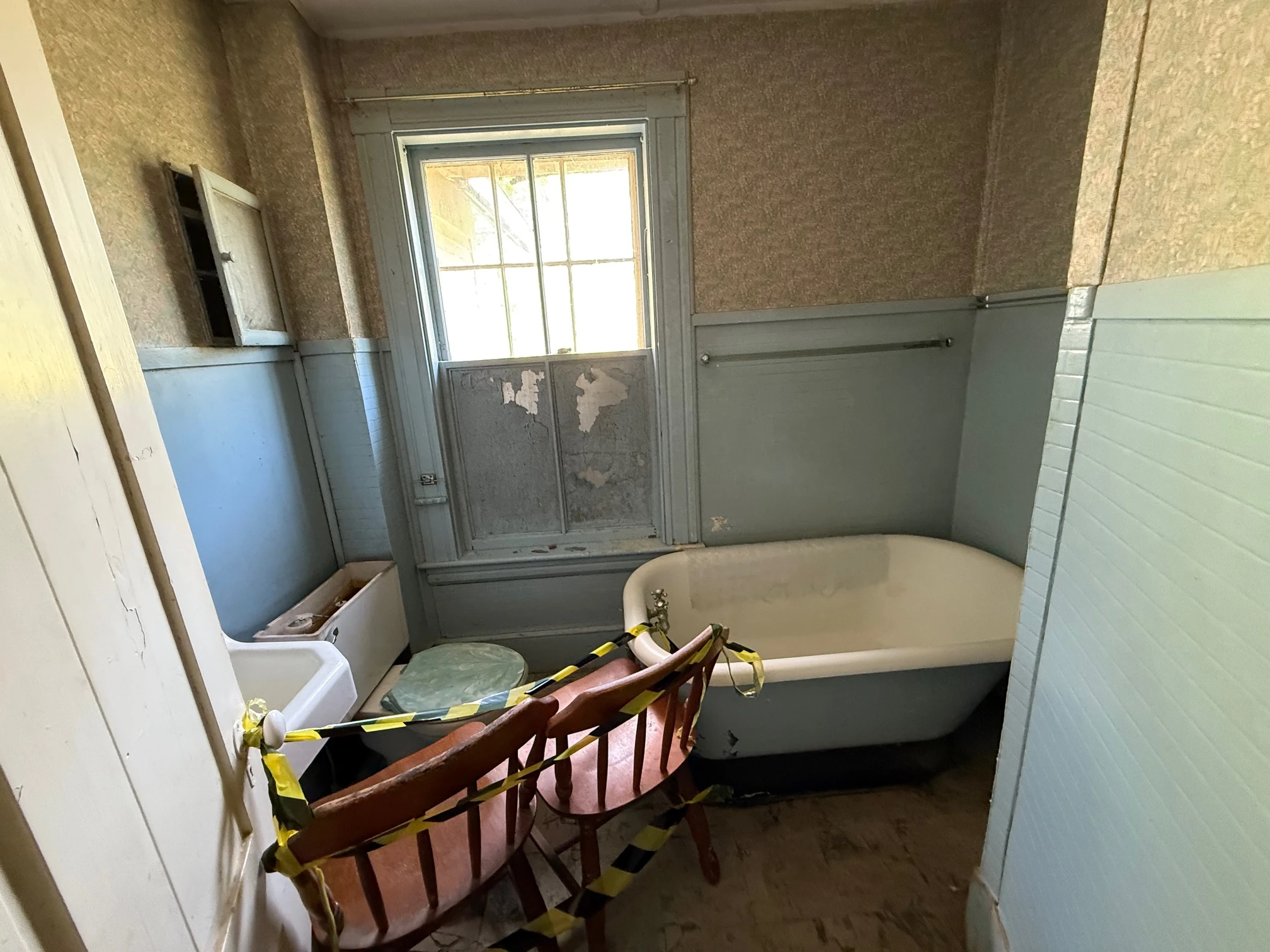 The original bathroom with old clawfoot tub